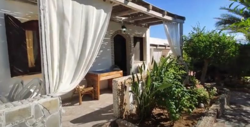 4 bungalows on private land within walking distance to popular beach and town .