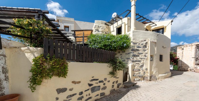 Charming village house with courtyard & sea view terraces.